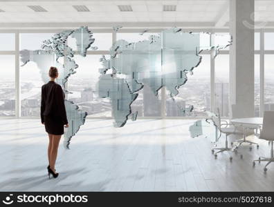 Businesswoman in top floor office. Elegant businesswoman in modern office interior against window panoramic view