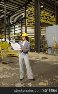 Businesswoman in warehouse