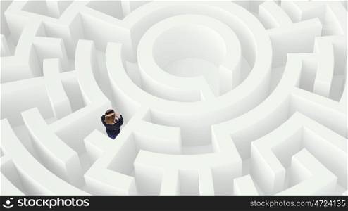 Businesswoman in white labyrinth Mixed media. Puzzled young businesswoman standing in white labyrinth
