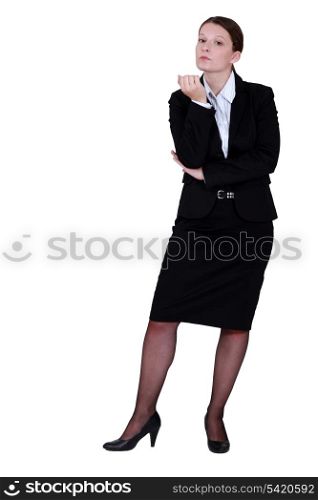 Businesswoman inspecting her nails
