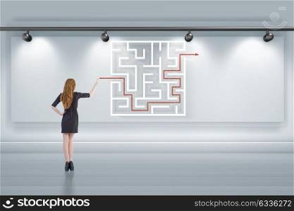 Businesswoman is looking for ways to escape from maze labyrinth. The businesswoman is looking for ways to escape from maze labyrinth