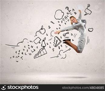 Businesswoman jumping. Image of businesswoman in jump against clouds background