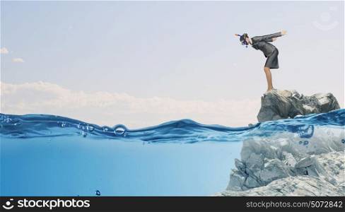 Businesswoman jumping in water. Businesswoman in diving mask jumping in water