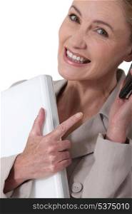 Businesswoman laughing on the phone