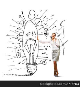 Businesswoman leaning on bulb