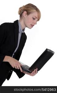 businesswoman looking at her laptop