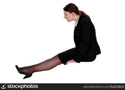 Businesswoman looking at her shoes