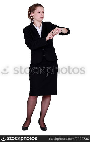 Businesswoman looking at wrist watch