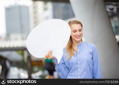 Businesswoman Looking Away While Holding Blank Thought Bubble