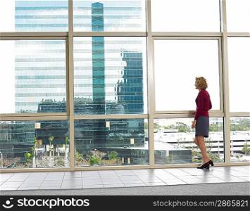Businesswoman looking out of office window