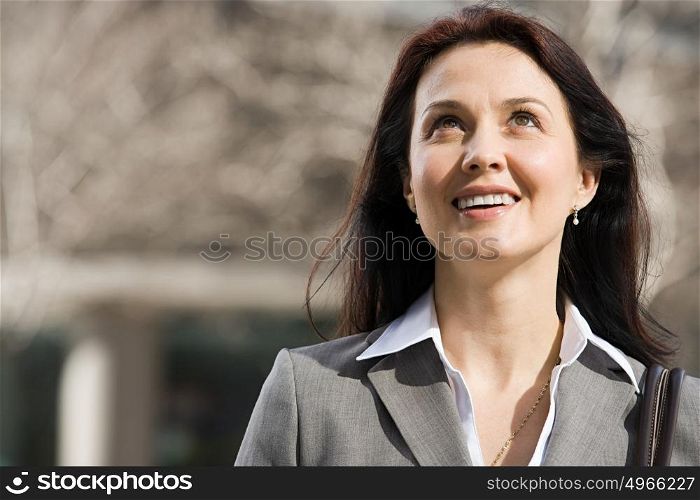 Businesswoman looking up