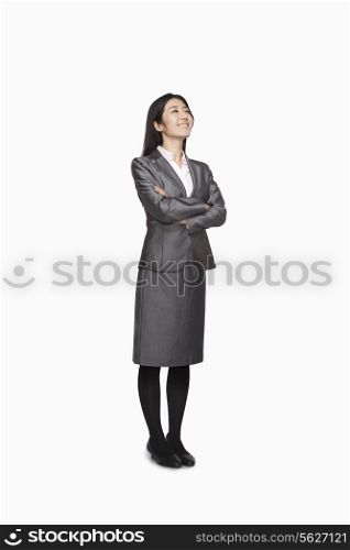 Businesswoman looking up and smiling