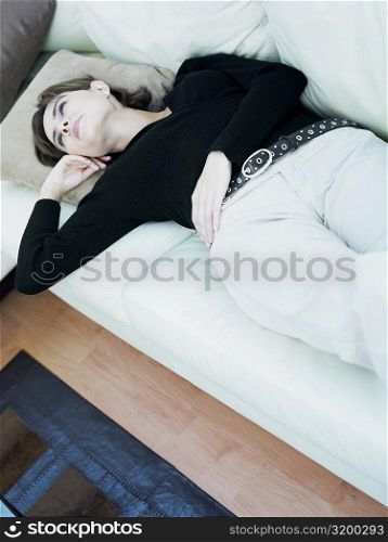 Businesswoman lying on a couch