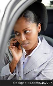 Businesswoman making a call from her car