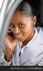 Businesswoman making a call from her car