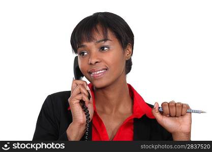 Businesswoman making a call to customer