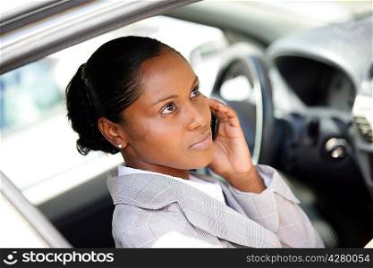 Businesswoman making a call whilst in parked car