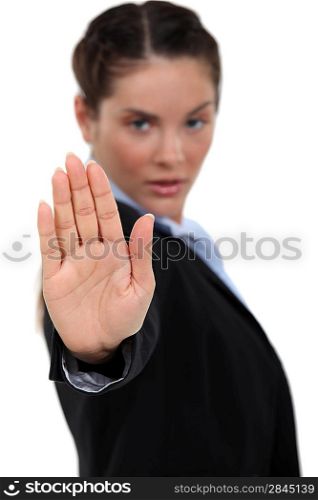 Businesswoman making stop gesture