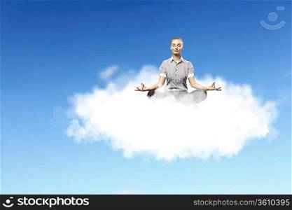 Businesswoman meditating sitting on the white cloud