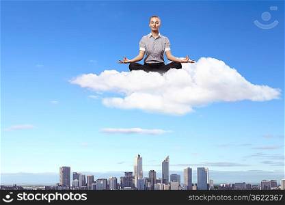 Businesswoman meditating sitting on the white cloud
