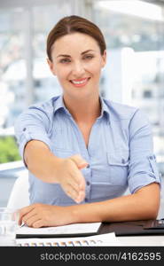 Businesswoman offering hand in greeting