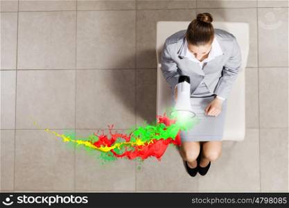 Businesswoman on chair. Top view of young businesswoman with megaphone sitting on chair