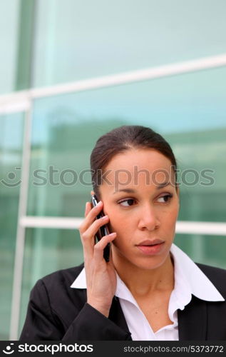 Businesswoman on phone outdoors