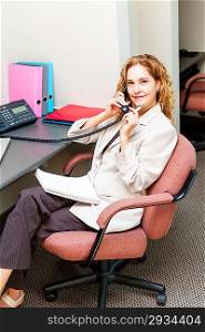 Businesswoman on telephone at office desk