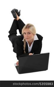 Businesswoman on the floor with laptop