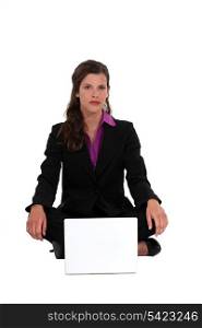 Businesswoman on the floor with notebook