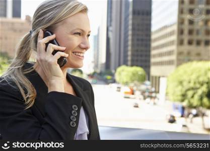 Businesswoman Outside Office On Mobile Phone