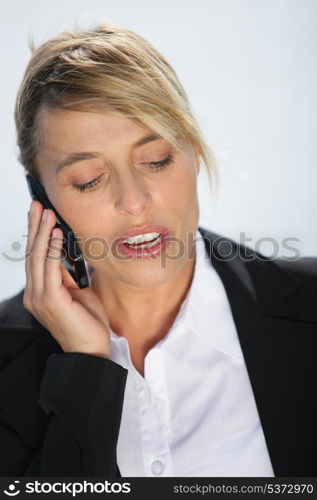 Businesswoman outside on the phone