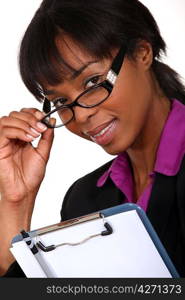 Businesswoman peering over her glasses