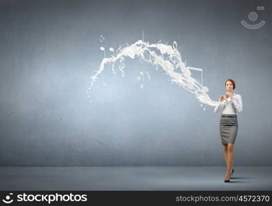 Businesswoman playing fife. Cheerful businesswoman playing fife on color background