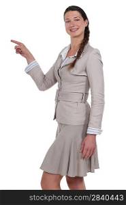 Businesswoman pointing at copy space
