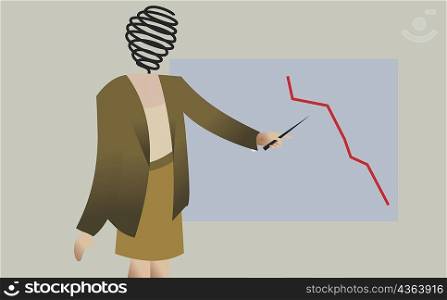 Businesswoman pointing to a graph on a wall