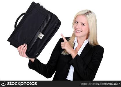 Businesswoman pointing to her briefcase
