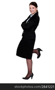 Businesswoman posing in a skirt suit