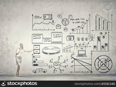Businesswoman present her ideas. Beautiful businesswoman leaning on banner with plan sketches
