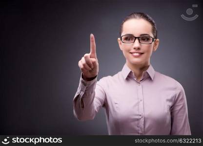Businesswoman pressing virtual button in business concept