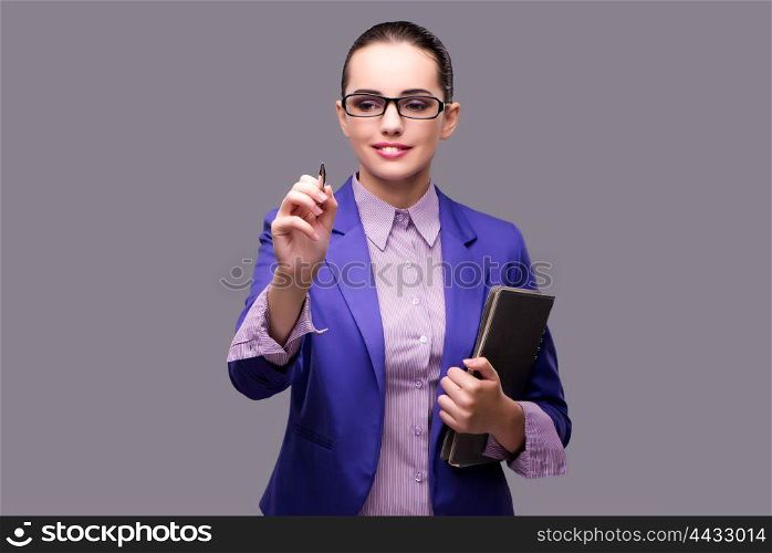 Businesswoman pressing virtual button with pen