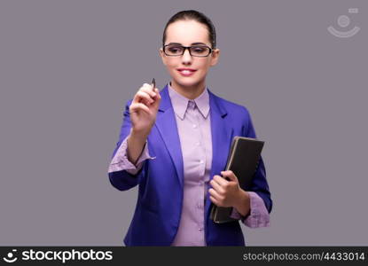 Businesswoman pressing virtual button with pen