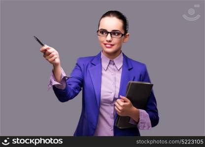 Businesswoman pressing virtual button with pen