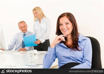Businesswoman pretty smile sitting in office with colleague team portrait