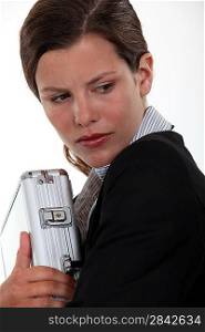 Businesswoman protecting a briefcase