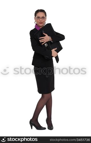 Businesswoman protecting her briefcase