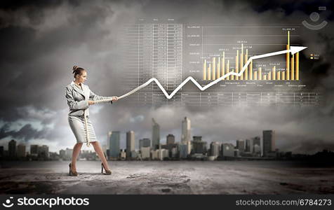 Businesswoman pulling graphic