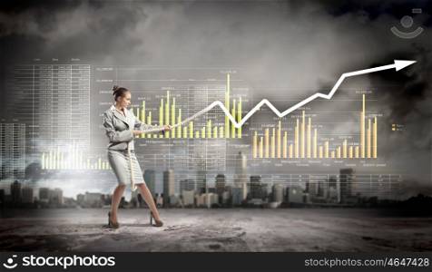 Businesswoman pulling graphic. Image of businesswoman pulling graph of diagram