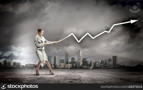 Businesswoman pulling graphic. Image of businesswoman pulling graph of diagram