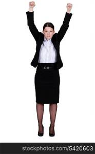 Businesswoman raising her hands